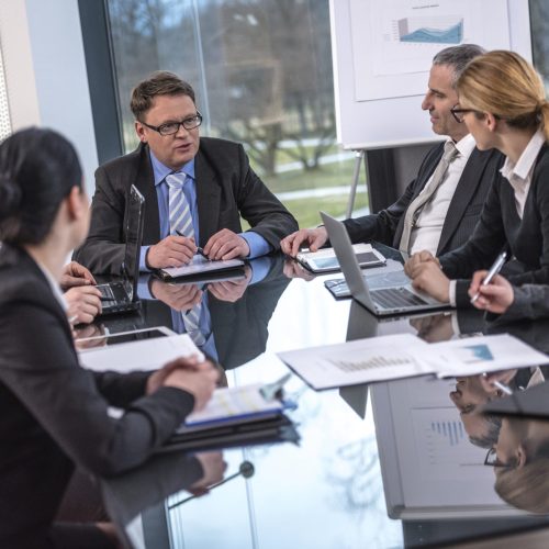 group-of-lawyers-business-people-at-conference-table